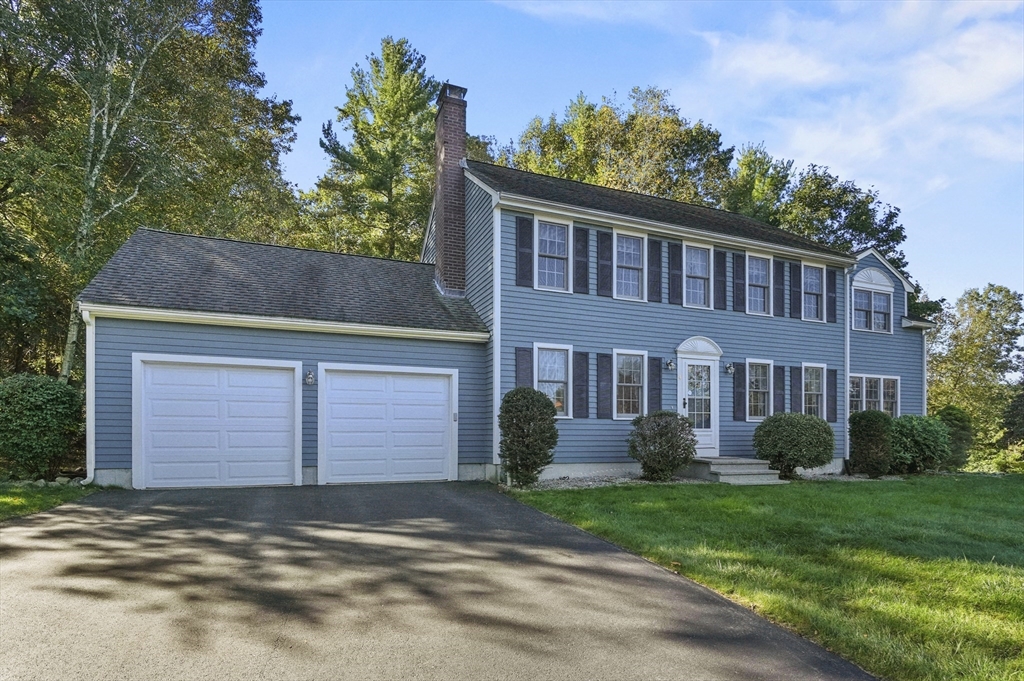 4 Jonathans Way Upton, MA 01568 - Photo 2 of 35 a front view of a house with garden