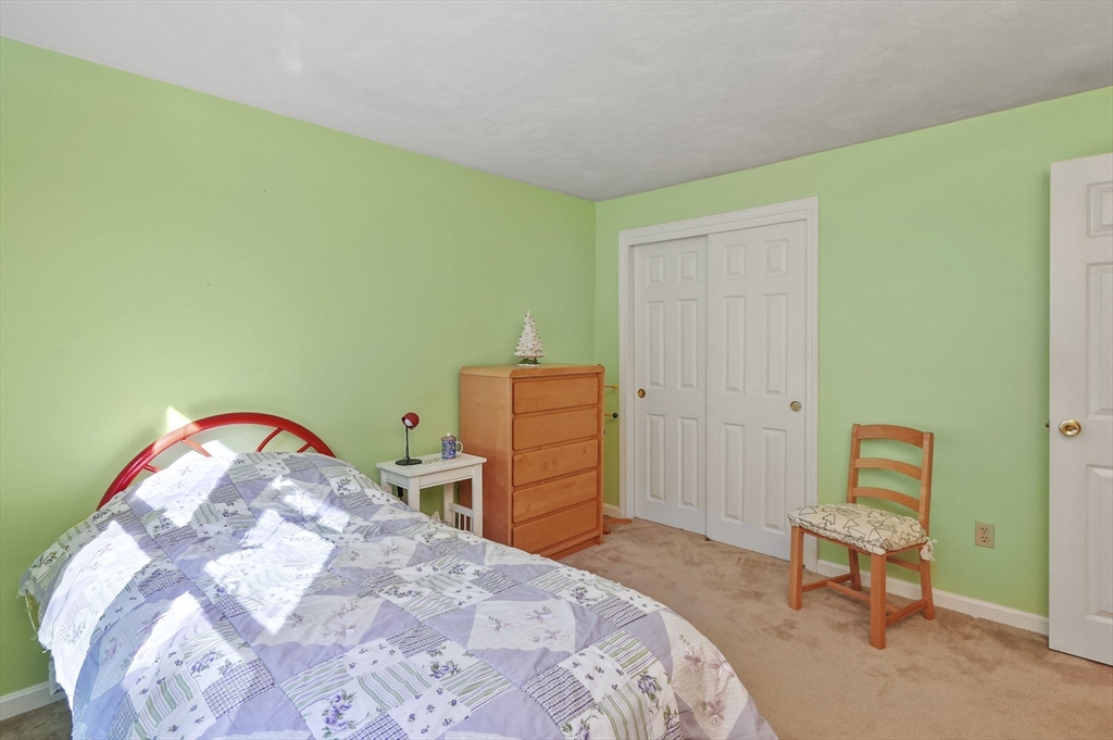 4 Jonathans Way Upton, MA 01568 - Photo 21 of 35 a bedroom with a bed and furniture