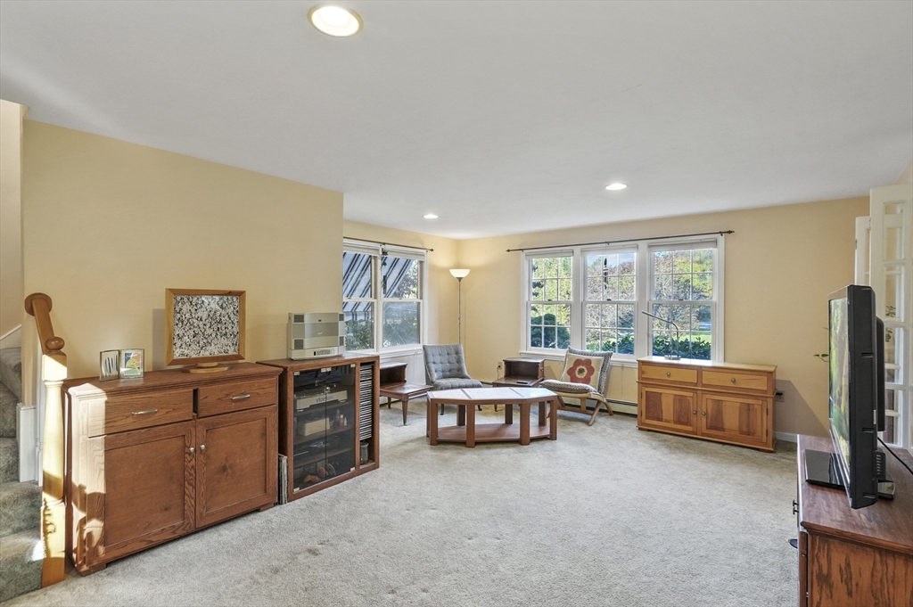 4 Jonathans Way Upton, MA 01568 - Photo 22 of 35 a view of a livingroom with furniture and a flat screen tv