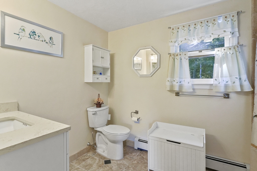 4 Jonathans Way Upton, MA 01568 - Photo 26 of 35 a bathroom with a toilet a sink and a window