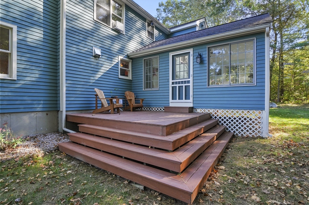 4 Jonathans Way Upton, MA 01568 - Photo 27 of 35 a view of a chairs setting in the backyard