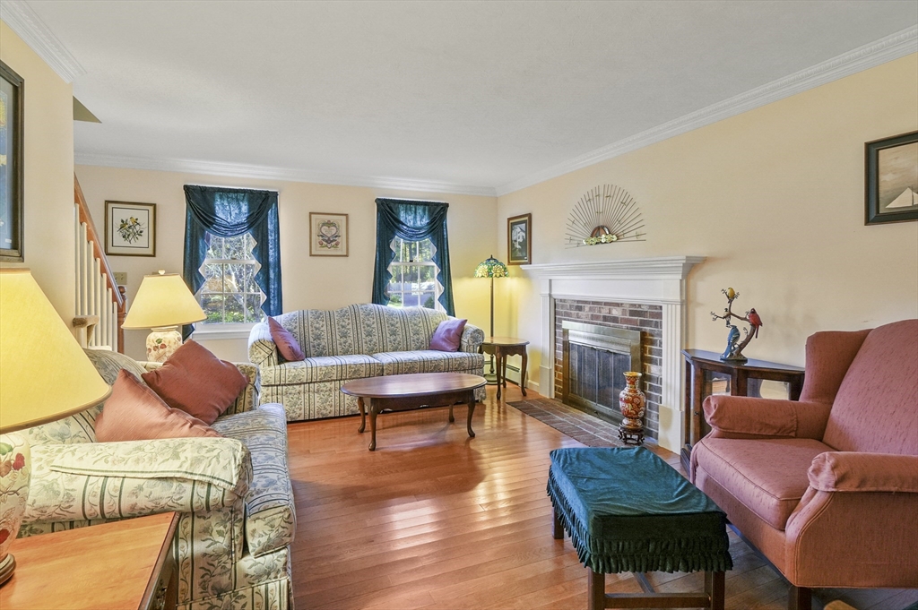 4 Jonathans Way Upton, MA 01568 - Photo 3 of 35 a living room with furniture and a fireplace