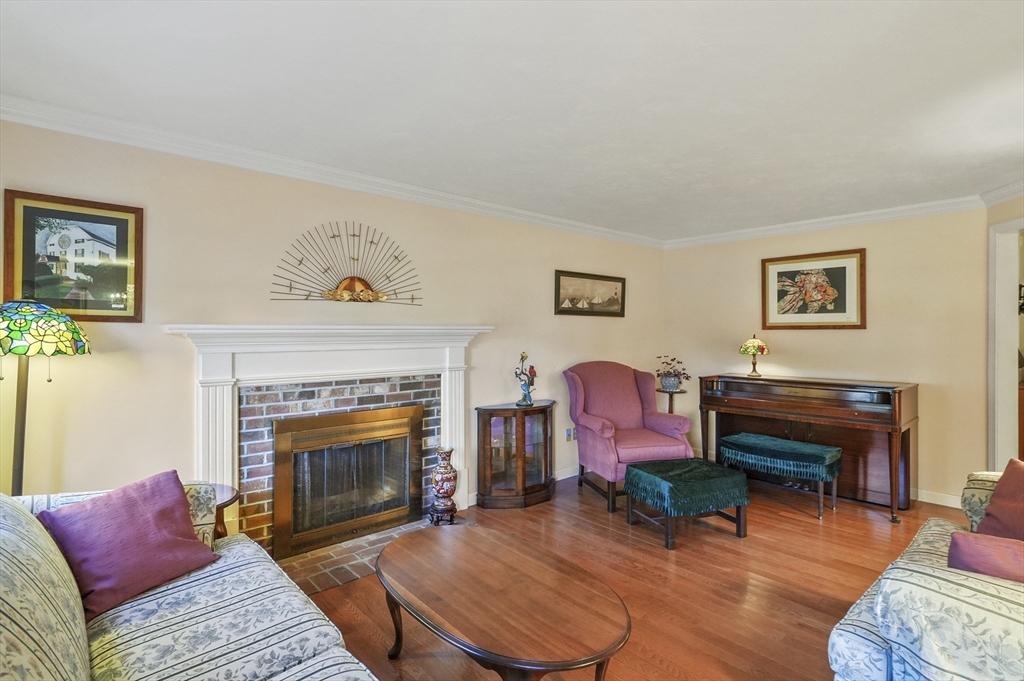 4 Jonathans Way Upton, MA 01568 - Photo 4 of 35 a living room with furniture and a fireplace