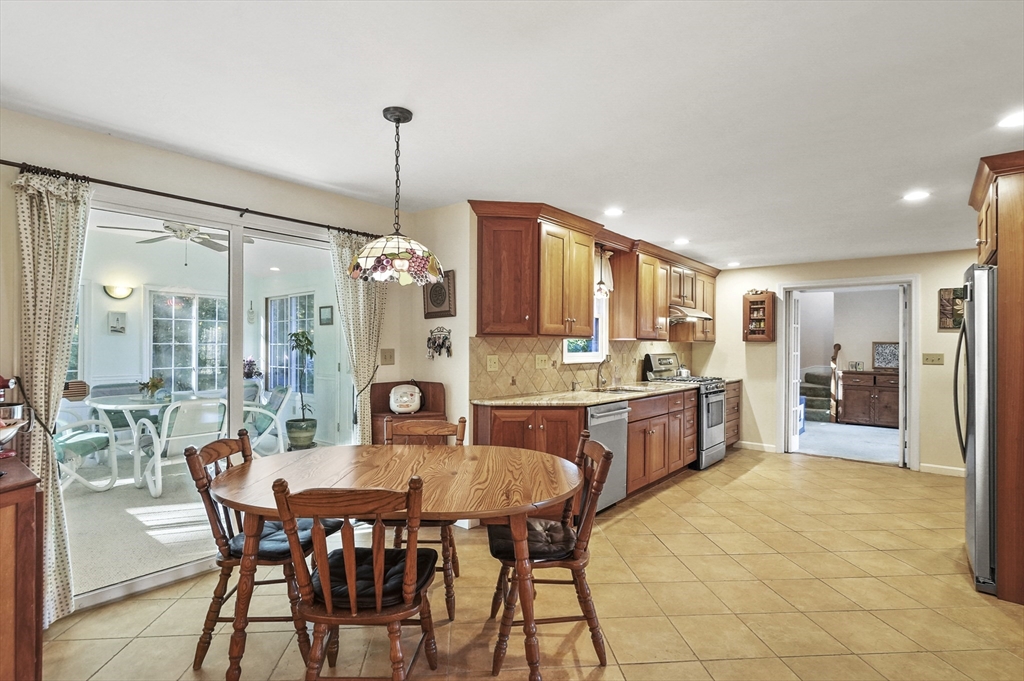 4 Jonathans Way Upton, MA 01568 - Photo 6 of 35 a dining room with a granite top table and chairs