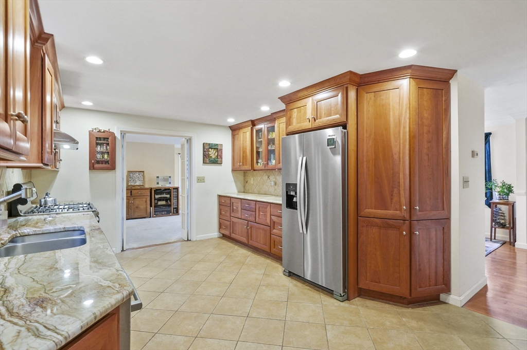 4 Jonathans Way Upton, MA 01568 - Photo 8 of 35 a kitchen with stainless steel appliances granite countertop a refrigerator and a sink