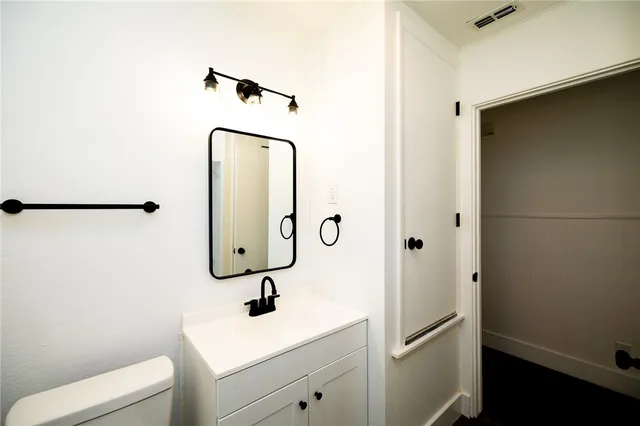 a bathroom with a sink and mirror