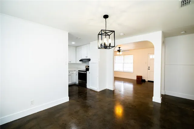 a view of a kitchen with a sink and dishwasher wooden floor