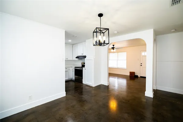 a view of a kitchen with a sink and dishwasher wooden floor