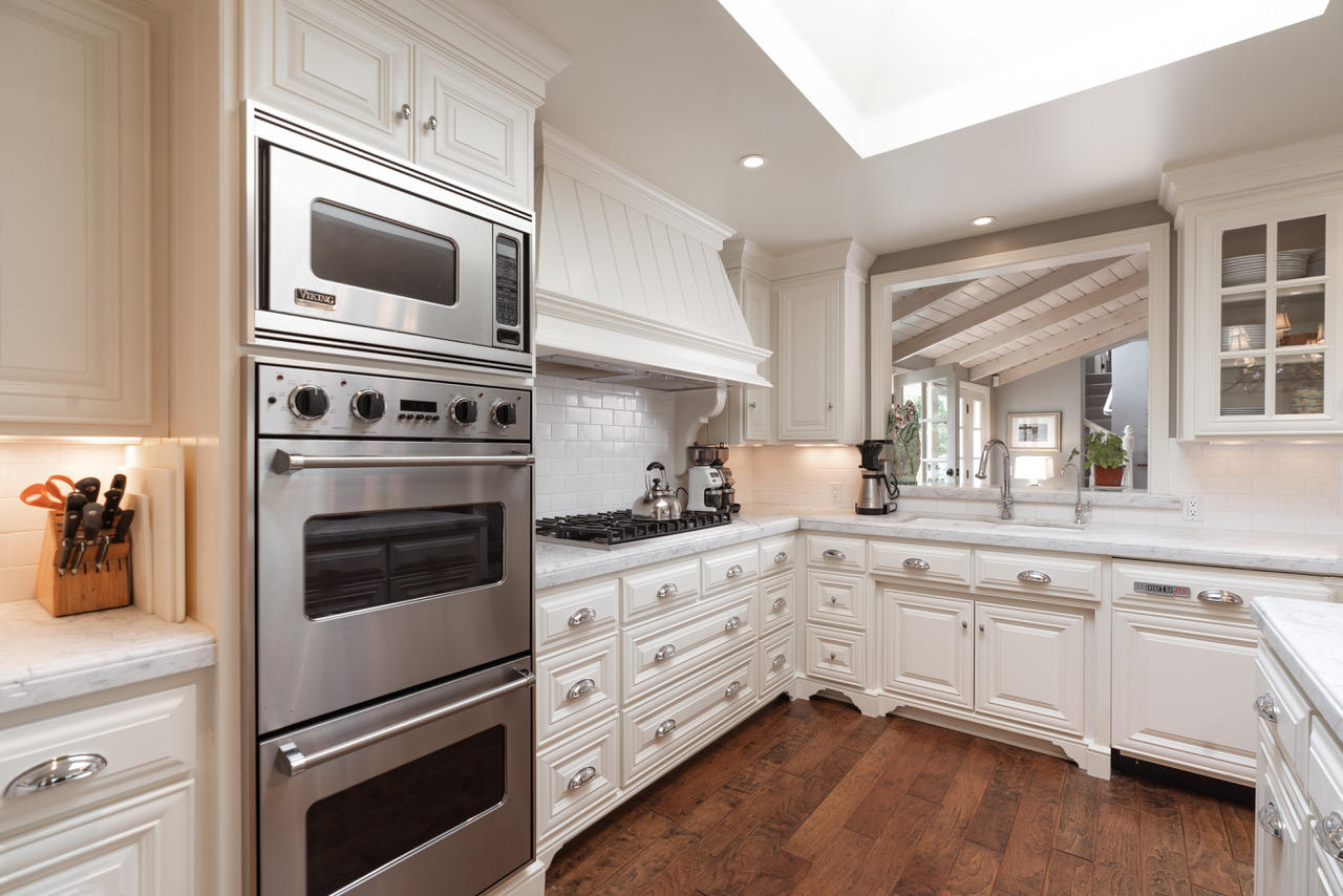 1077 Summit Road Santa Barbara, CA 93108 - Photo 15 of 49 a kitchen with granite countertop cabinets stainless steel appliances and wooden floor