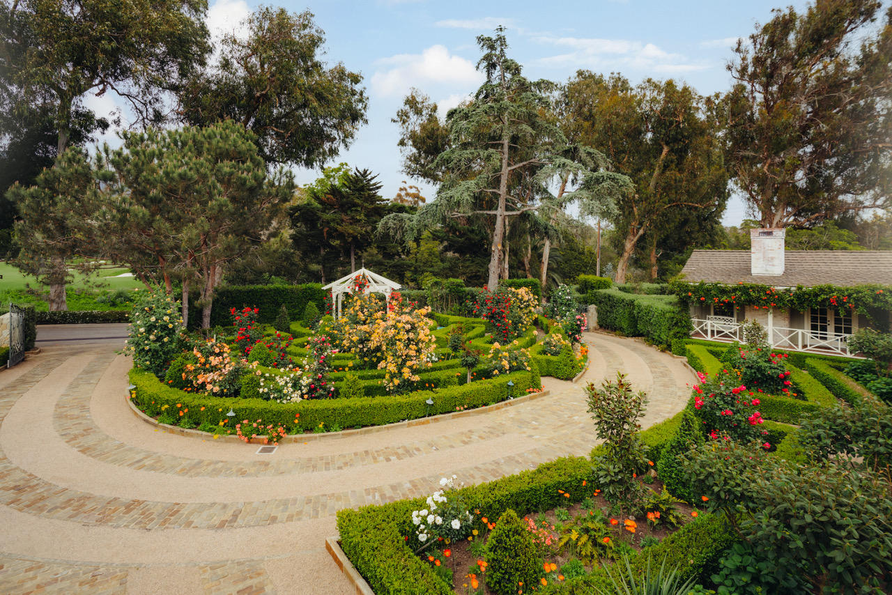1077 Summit Road Santa Barbara, CA 93108 - Photo 7 of 49 a view of a garden with a fountain
