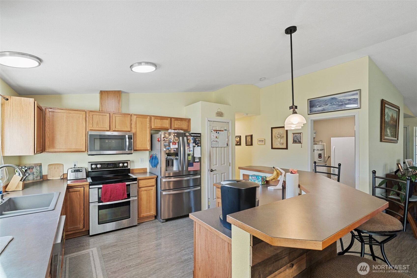 146 Rocky Lane Chehalis, WA 98532 - Photo 11 of 40 a kitchen with stainless steel appliances granite countertop a stove refrigerator and a sink