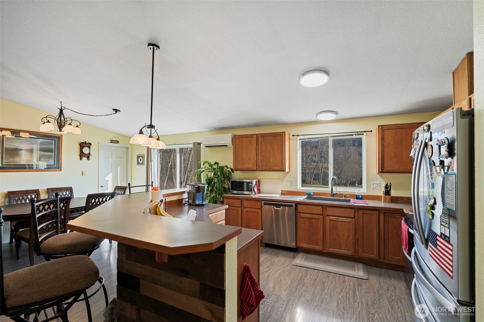 146 Rocky Lane Chehalis, WA 98532 - Photo 13 of 40 a kitchen with stainless steel appliances a dining table and chairs