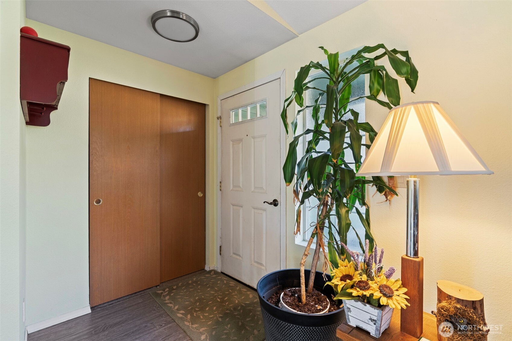 146 Rocky Lane Chehalis, WA 98532 - Photo 4 of 40 a vase of flowers sitting on a table with a potted plant