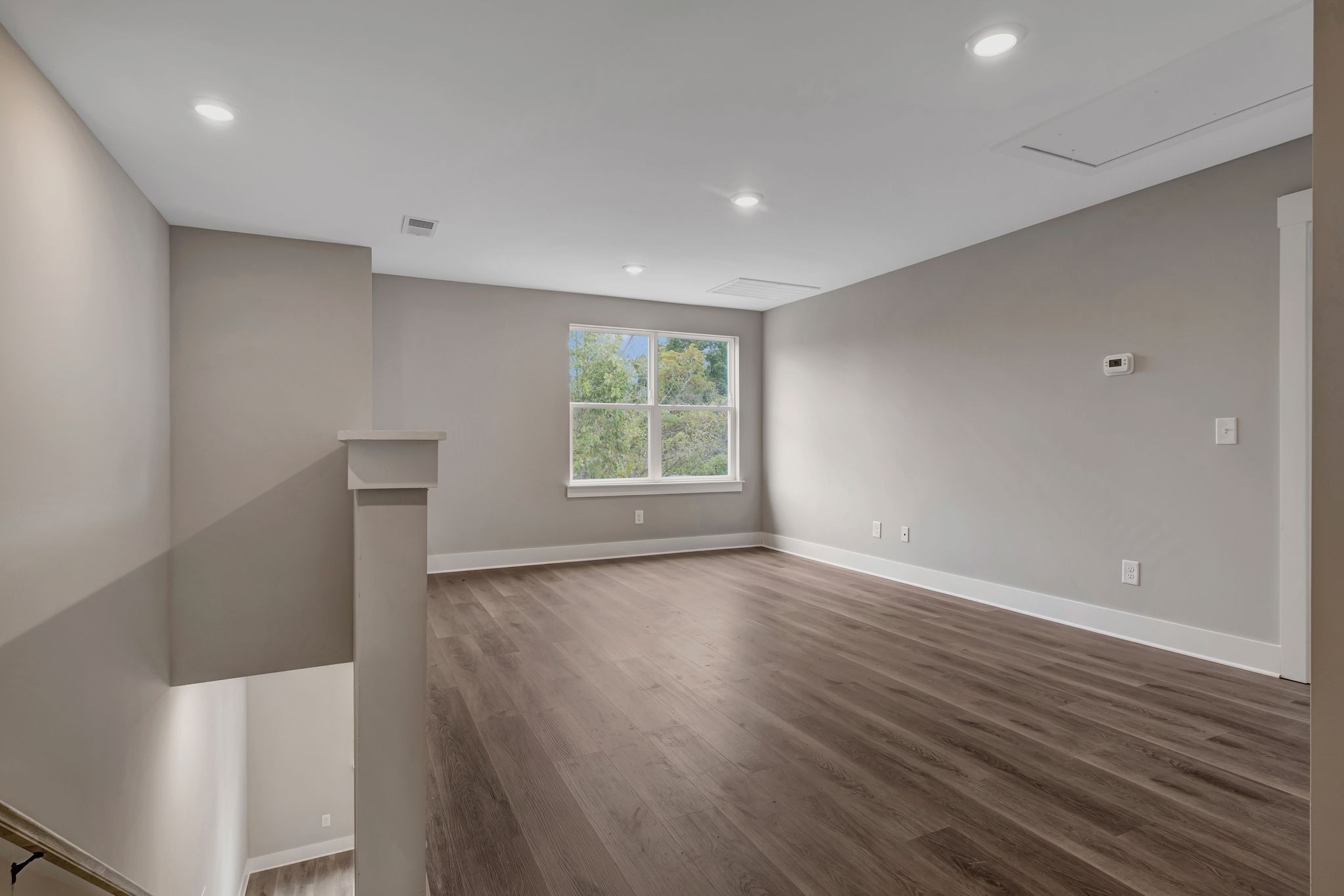 821 Saddle Ridge Drive Old Hickory, TN 37138 - Photo 15 of 29 a view of an empty room with wooden floor and a window