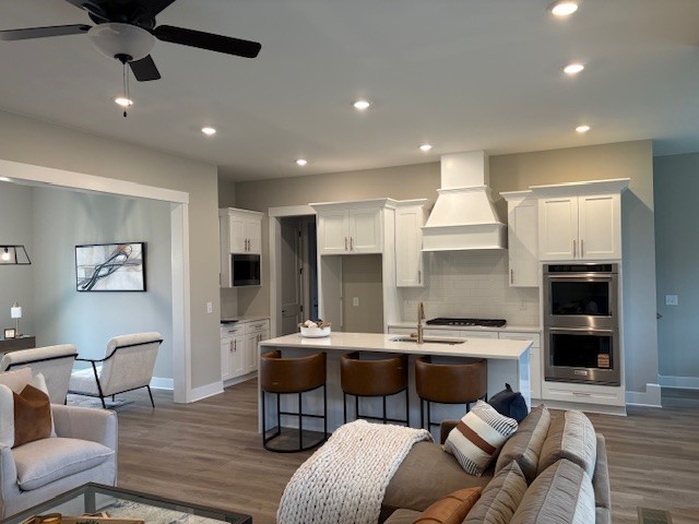 821 Saddle Ridge Drive Old Hickory, TN 37138 - Photo 6 of 29 a living room with furniture kitchen view and a wooden floor