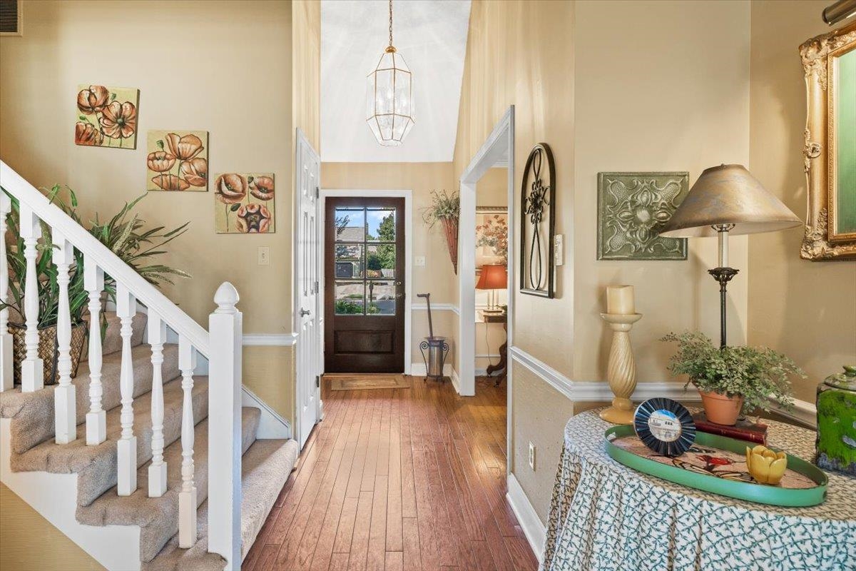 1880 Newfields Road Germantown, TN 38139 - Photo 14 of 34 Foyer entrance featuring wood-type flooring, stairway, and a towering ceiling