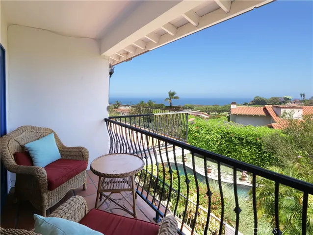 a view of balcony with furniture