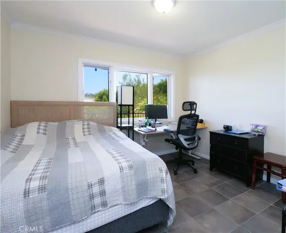 a bathroom with a granite countertop sink a toilet and a mirror