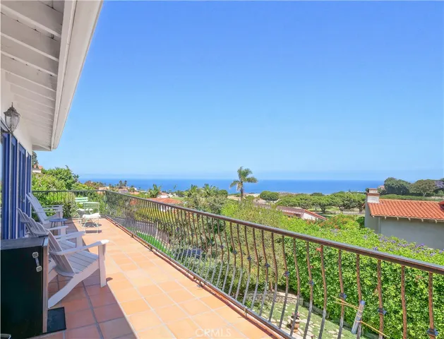 a view of a balcony with an ocean view