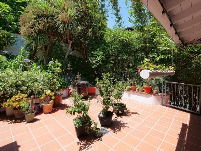 a view of a chairs and tables in the patio