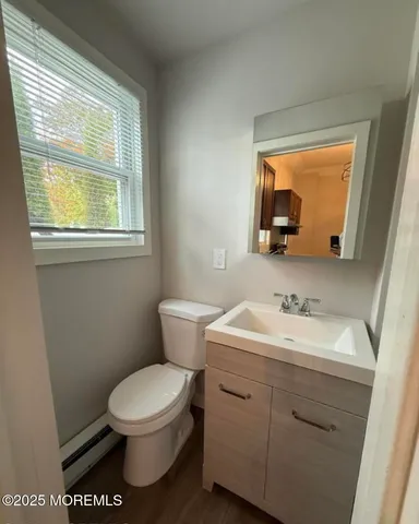 a bathroom with a shower a sink and a mirror