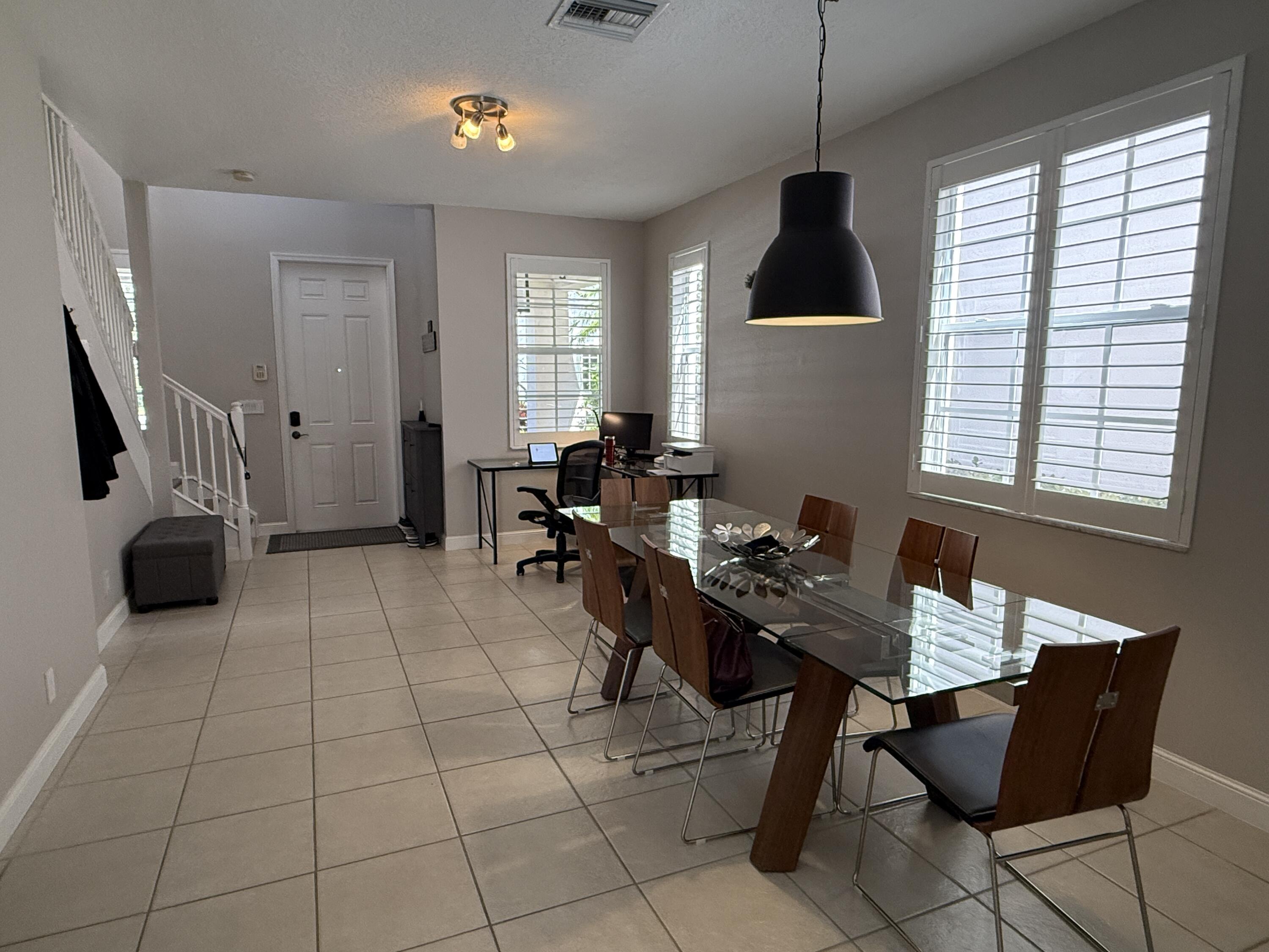 706 Duchess Court Palm Beach Gardens, FL 33410 - Photo 11 of 61 a workspace with furniture and window
