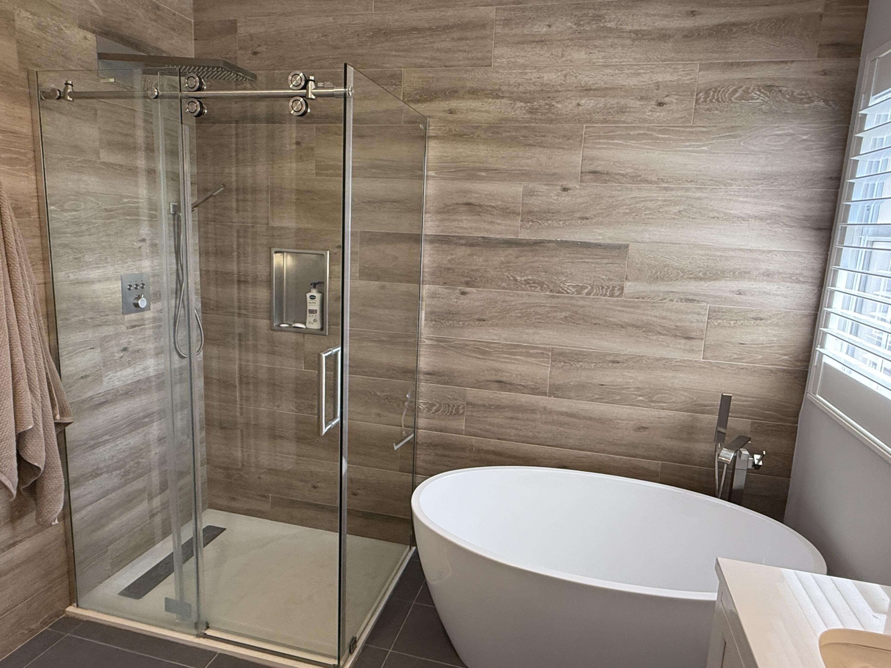 706 Duchess Court Palm Beach Gardens, FL 33410 - Photo 17 of 61 a bathroom with a white bath tub and shower