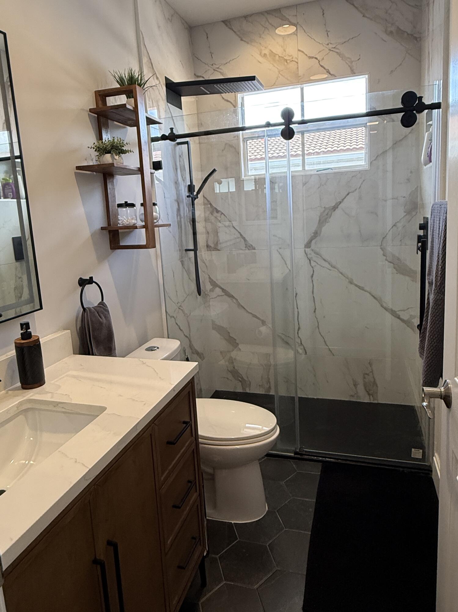 706 Duchess Court Palm Beach Gardens, FL 33410 - Photo 20 of 61 a bathroom with a sink toilet and shower