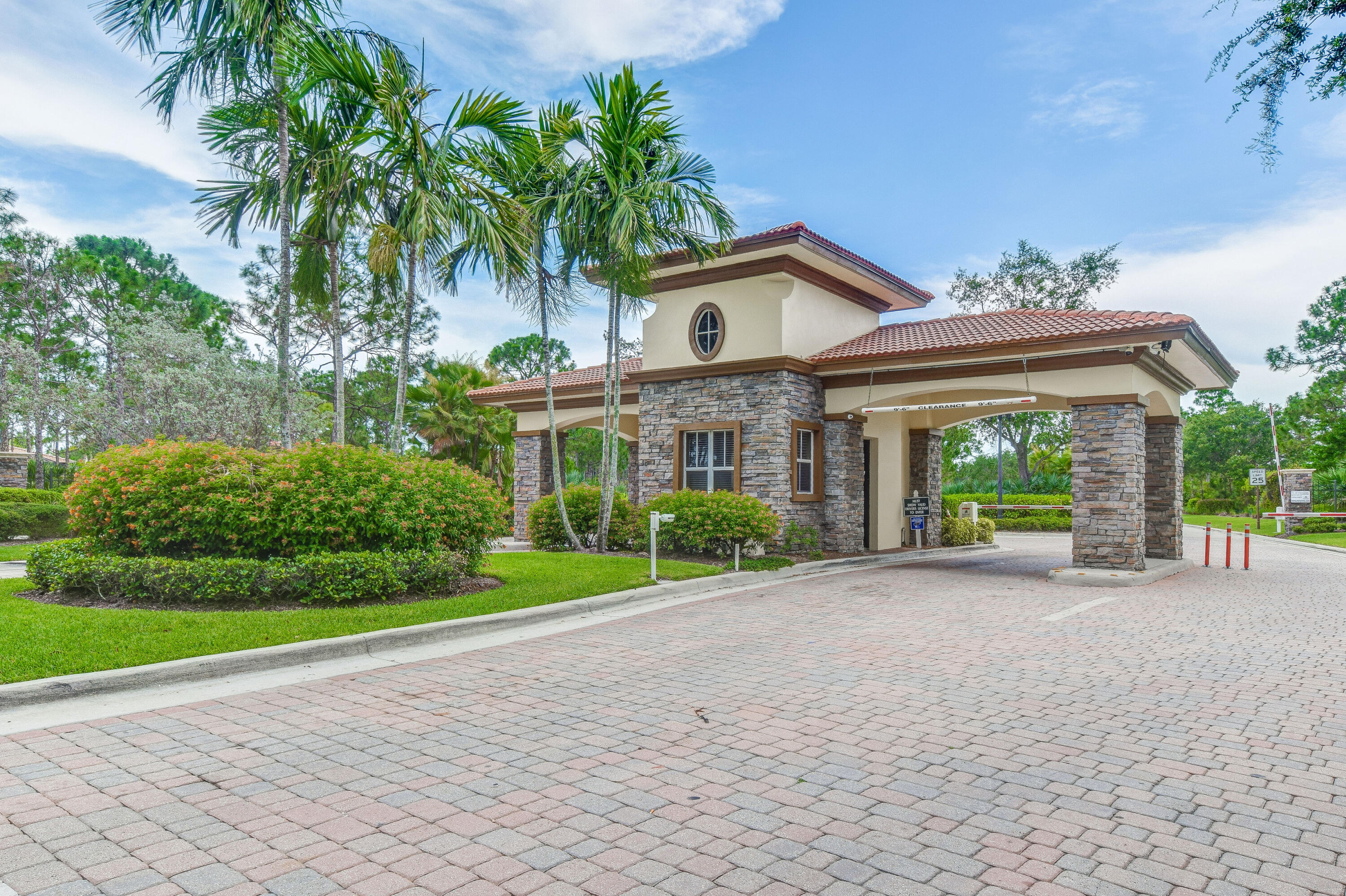 706 Duchess Court Palm Beach Gardens, FL 33410 - Photo 27 of 61 a view of a house with a yard and potted plants
