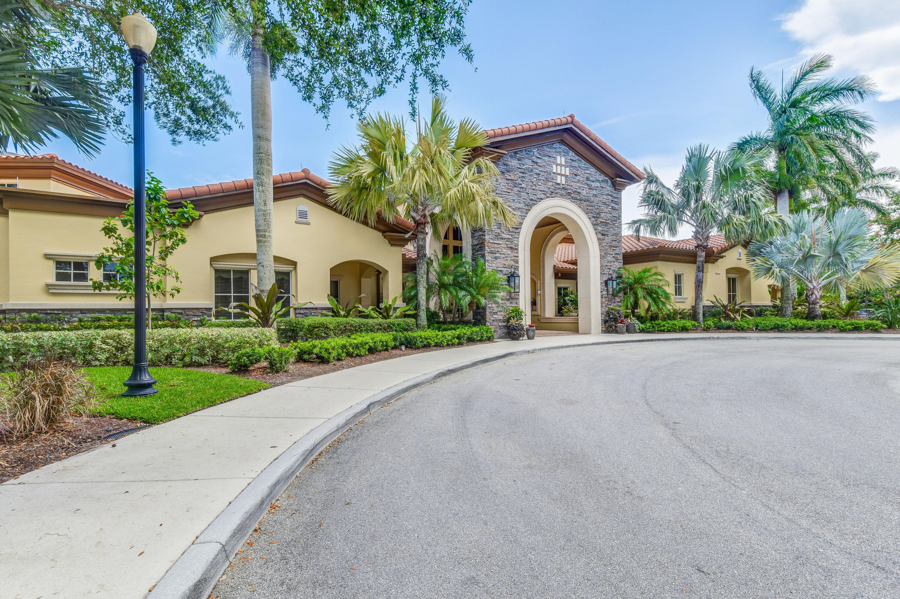 706 Duchess Court Palm Beach Gardens, FL 33410 - Photo 29 of 61 a front view of a house with garden
