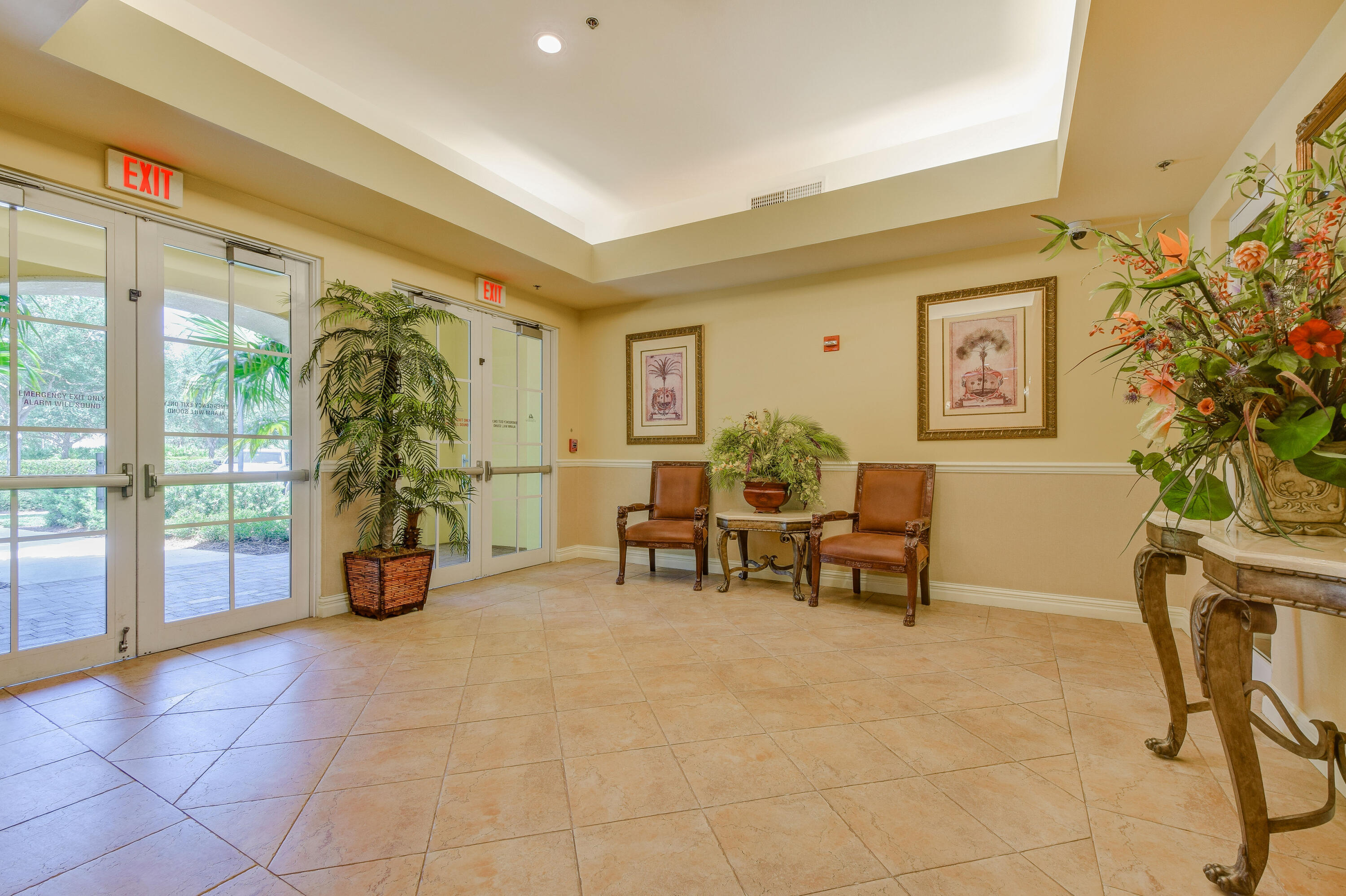 706 Duchess Court Palm Beach Gardens, FL 33410 - Photo 30 of 61 a living room with furniture and a large window