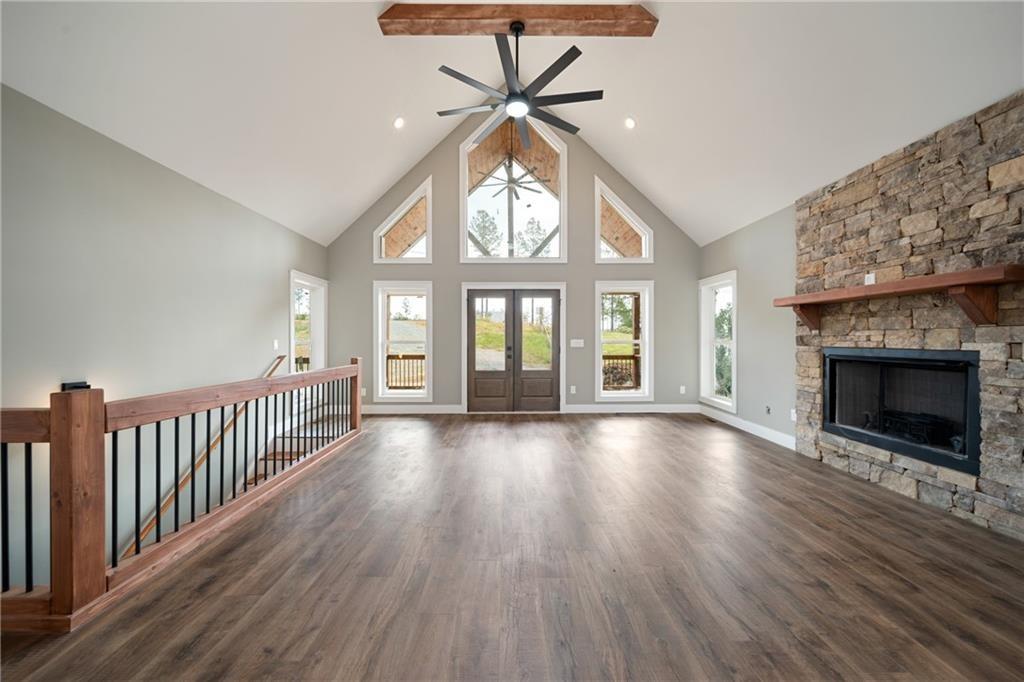 2956 Blalock Mountain Road Talking Rock, GA 30175 - Photo 5 of 63 wooden floor in an empty room with a fireplace