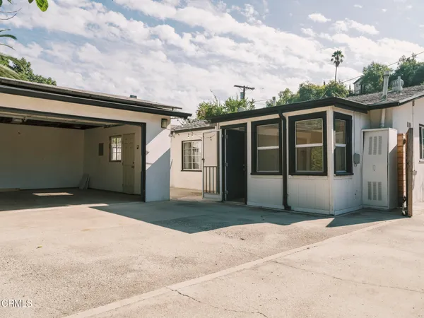 a front view of a house with a garage