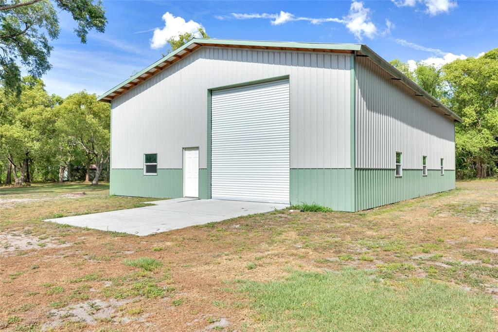 3535 Moores Lake Road Dover, FL 33527 - Photo 64 of 85 40x60 Garage Workshop - The two 14' tall roll-up doors create a DRIVE-THROUGH!