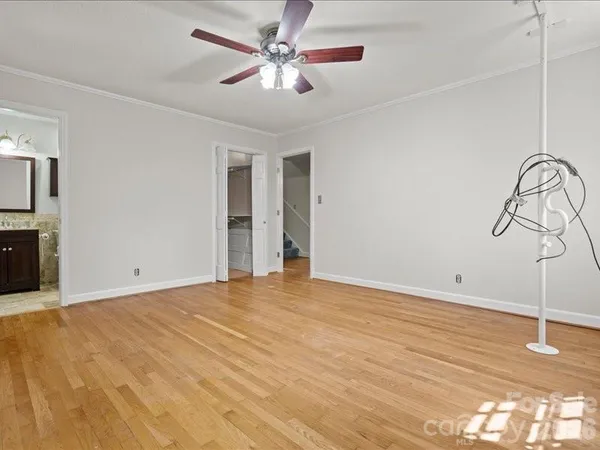 a view of empty room with ceiling fan