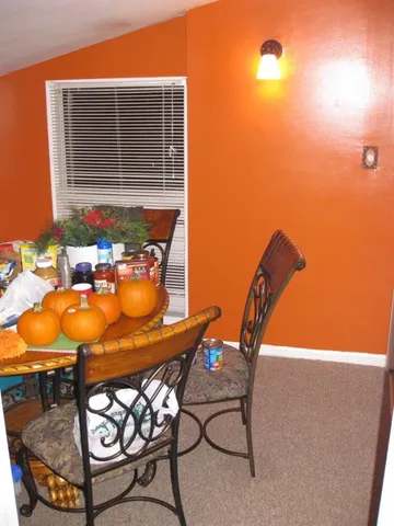 a patio with table and chairs