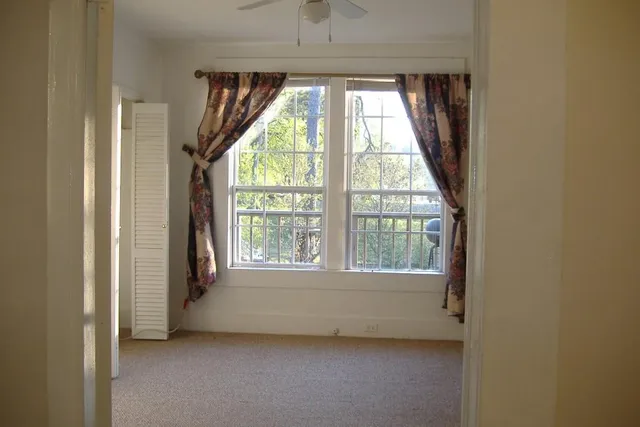 a view of an empty room with a window