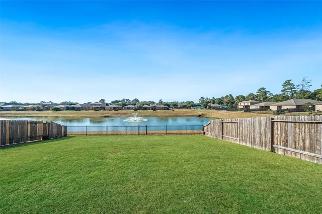 a view of a lake with houses in the back