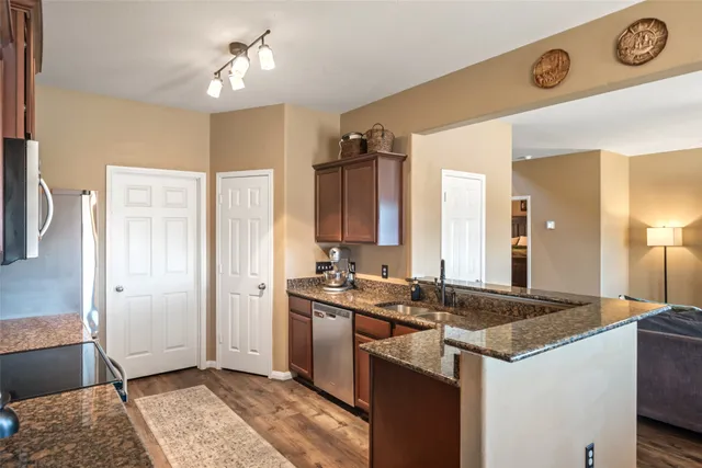 a kitchen with a sink and refrigerator