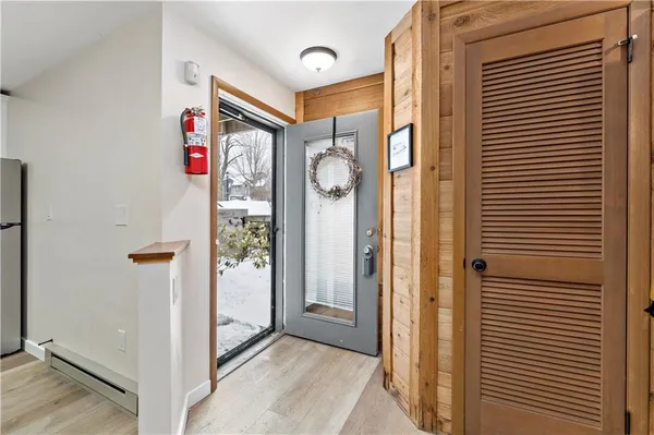 a view of a hallway with front door
