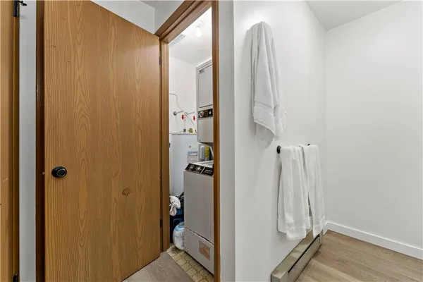 a bathroom with a glass door shower and a sink