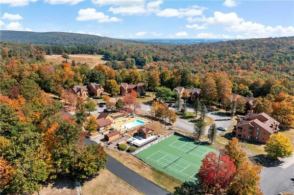 an aerial view of residential houses with outdoor space