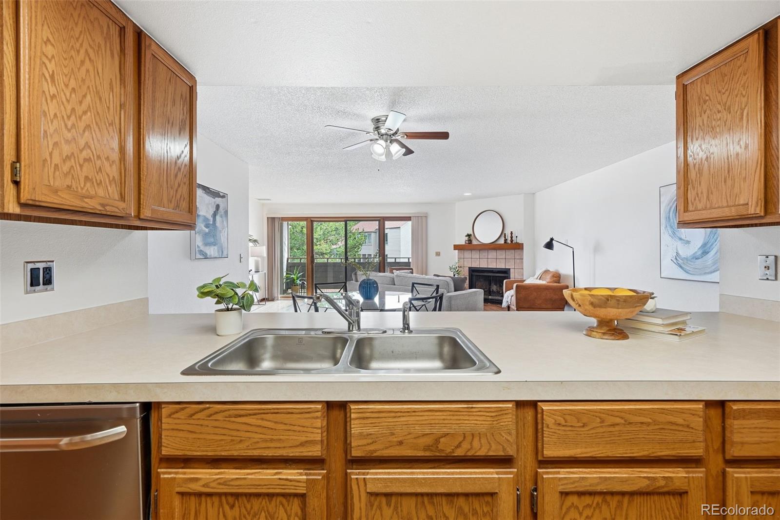 23557 Genesee Village Road, Unit A Golden, CO 80401 - Photo 11 of 38 a kitchen with a sink cabinets and window