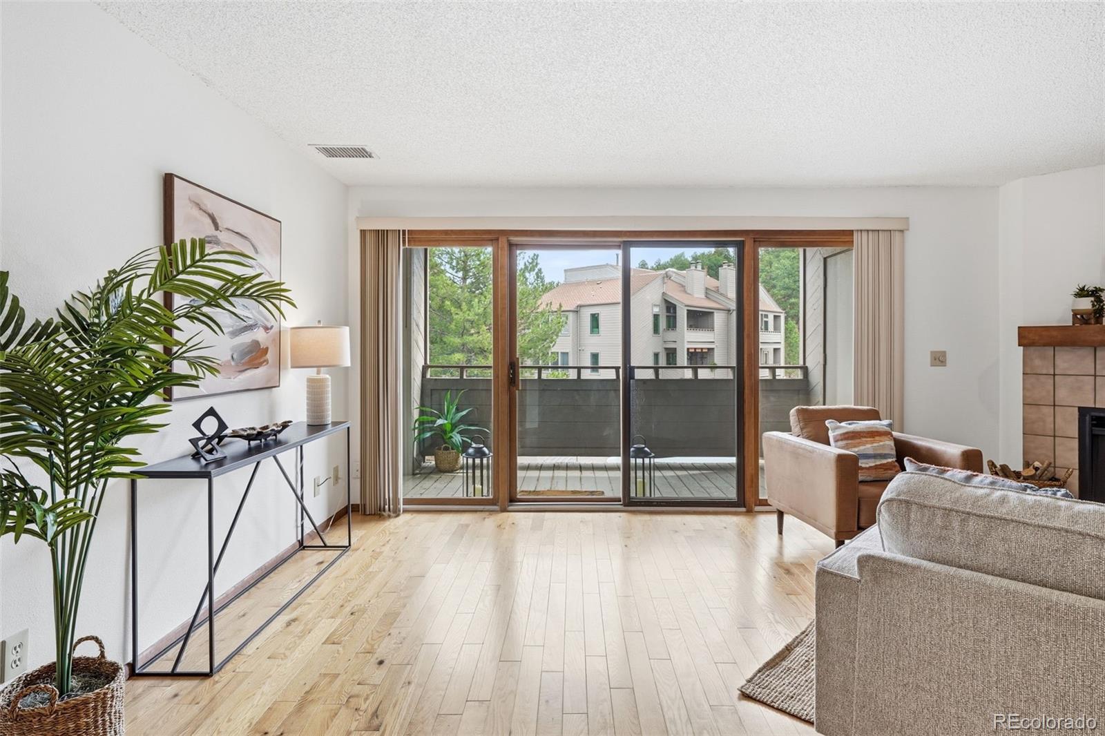 23557 Genesee Village Road, Unit A Golden, CO 80401 - Photo 2 of 38 a living room with furniture and a large window