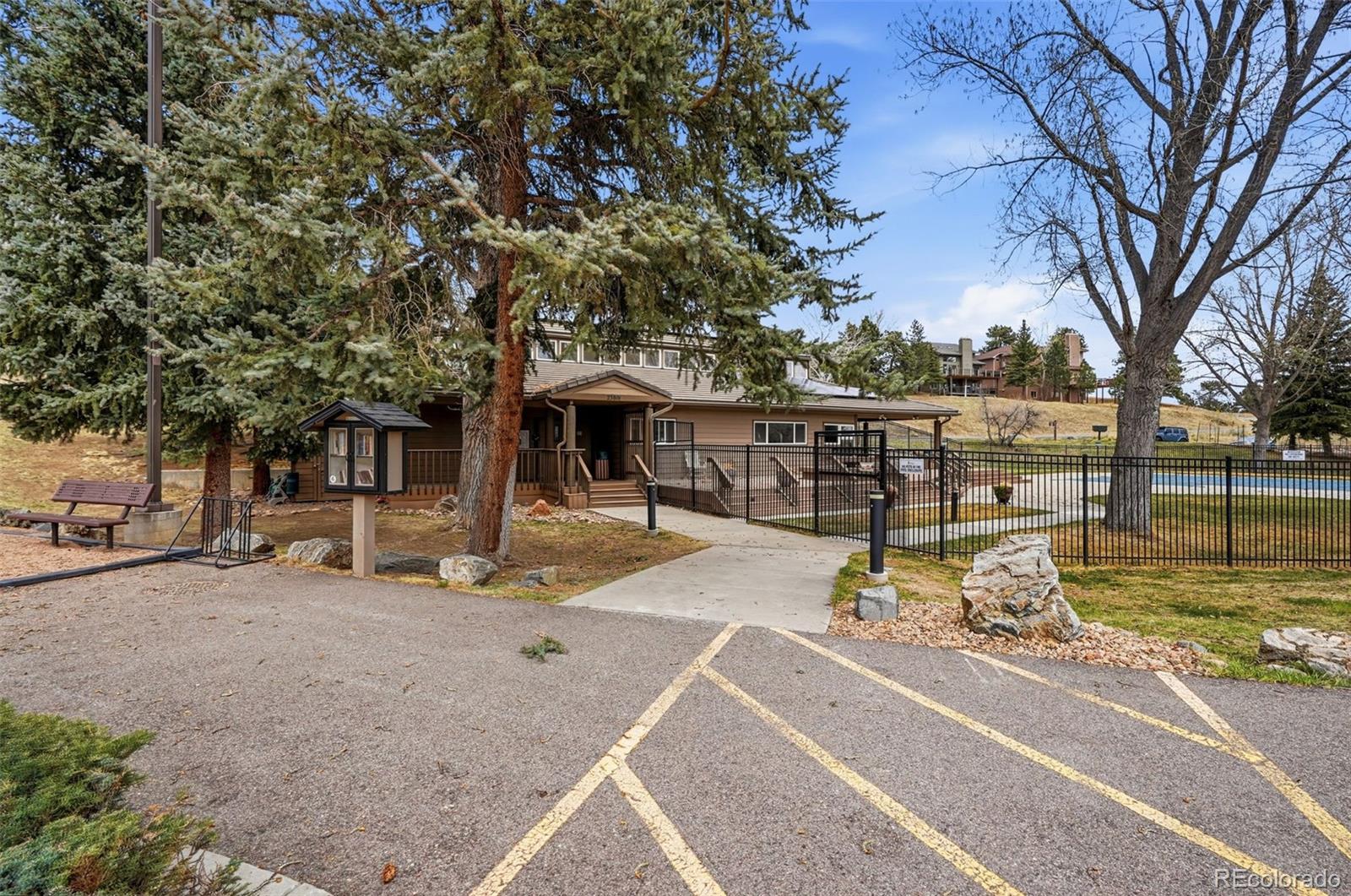 23557 Genesee Village Road, Unit A Golden, CO 80401 - Photo 31 of 38 a view of a house with backyard porch and sitting area