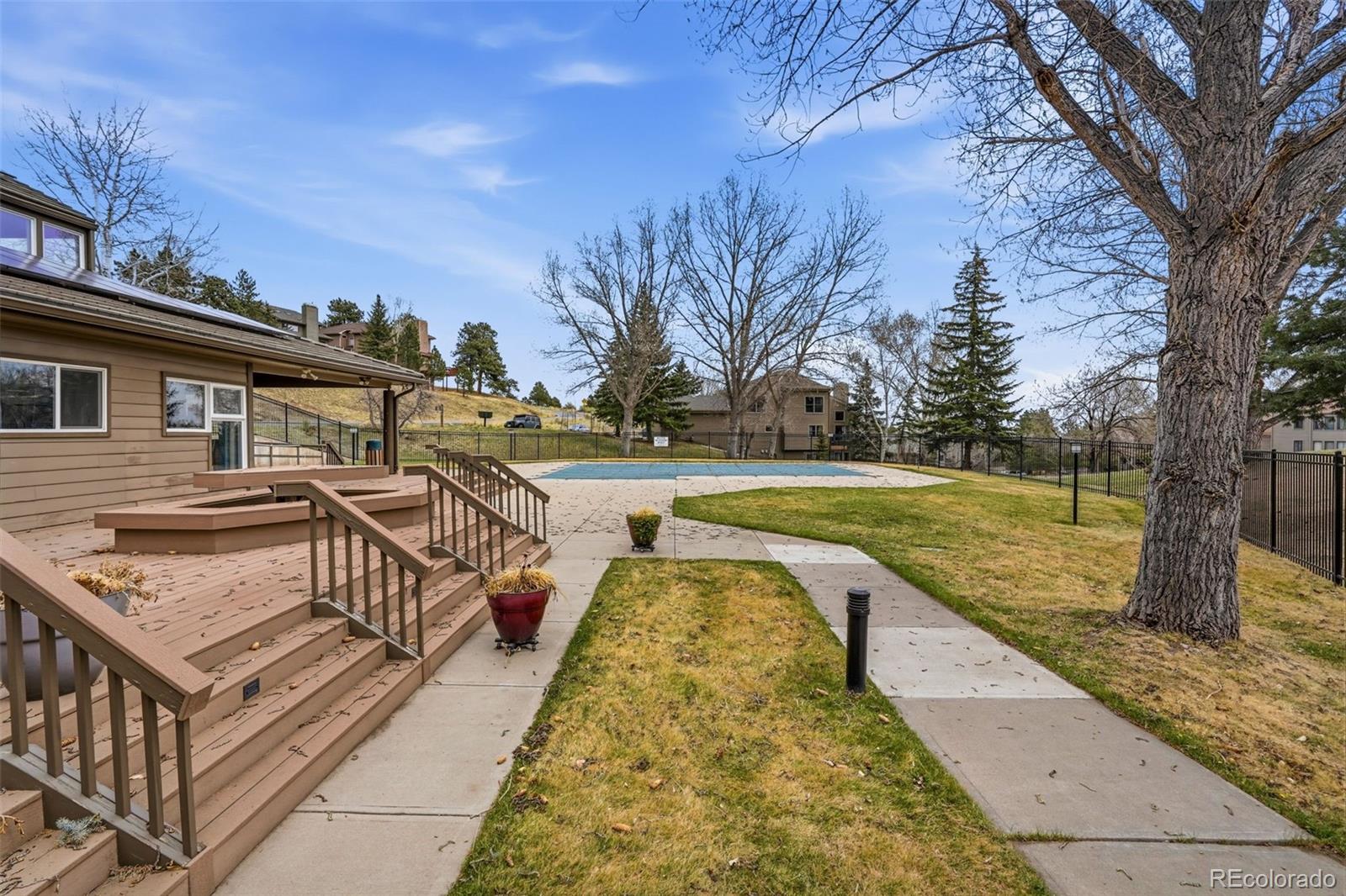 23557 Genesee Village Road, Unit A Golden, CO 80401 - Photo 32 of 38 a view of a house with swimming pool and sitting area