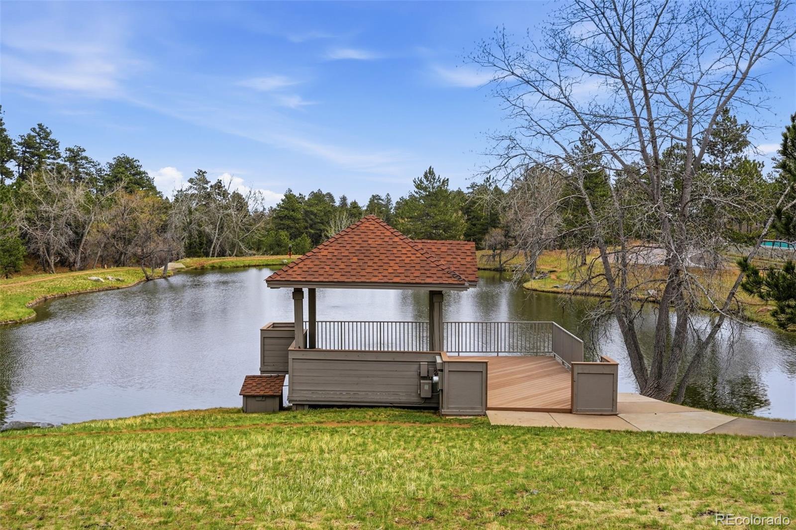 23557 Genesee Village Road, Unit A Golden, CO 80401 - Photo 34 of 38 a view of a house with a yard