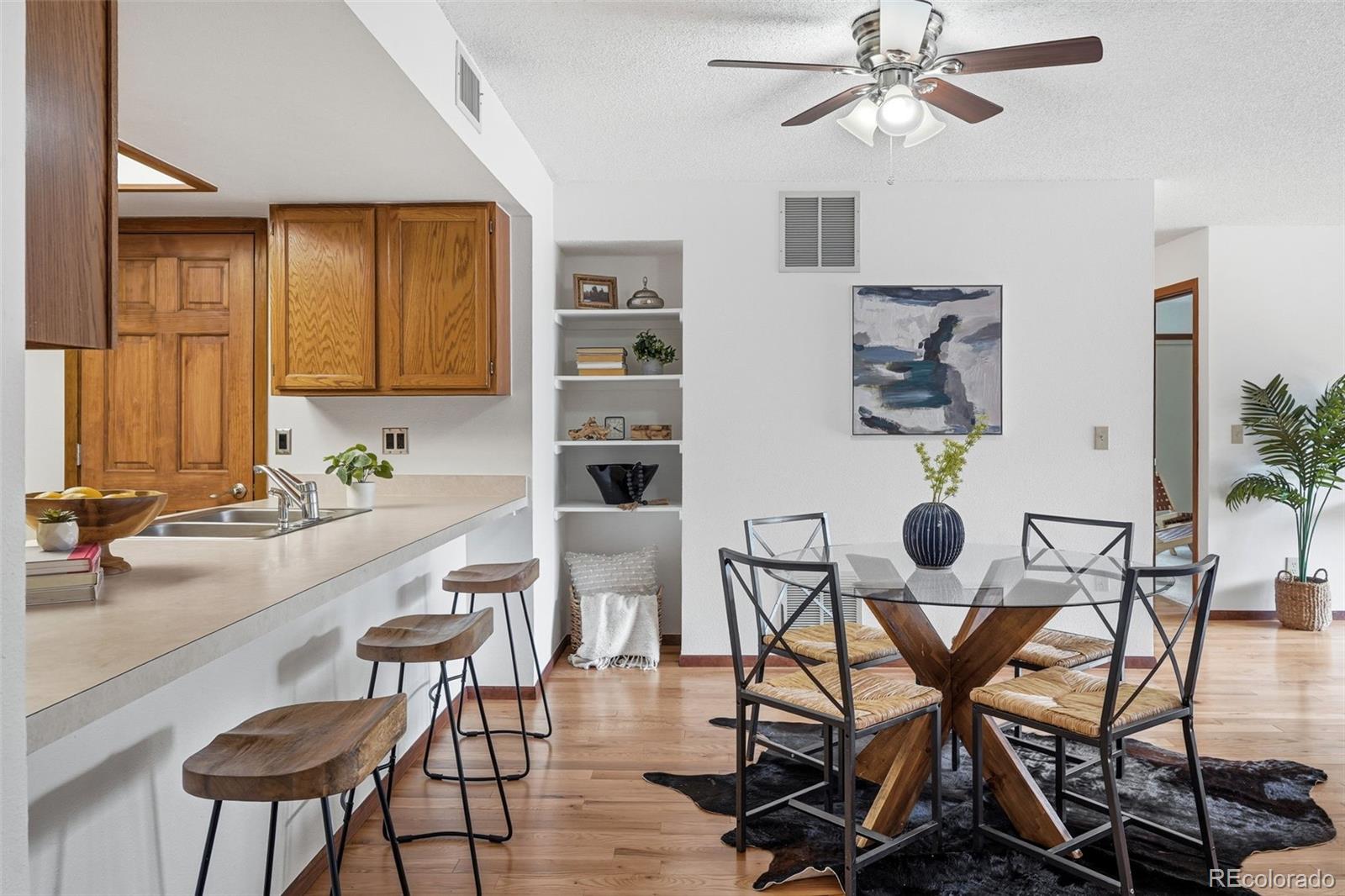 23557 Genesee Village Road, Unit A Golden, CO 80401 - Photo 5 of 38 a view of a dining room with furniture and chandelier