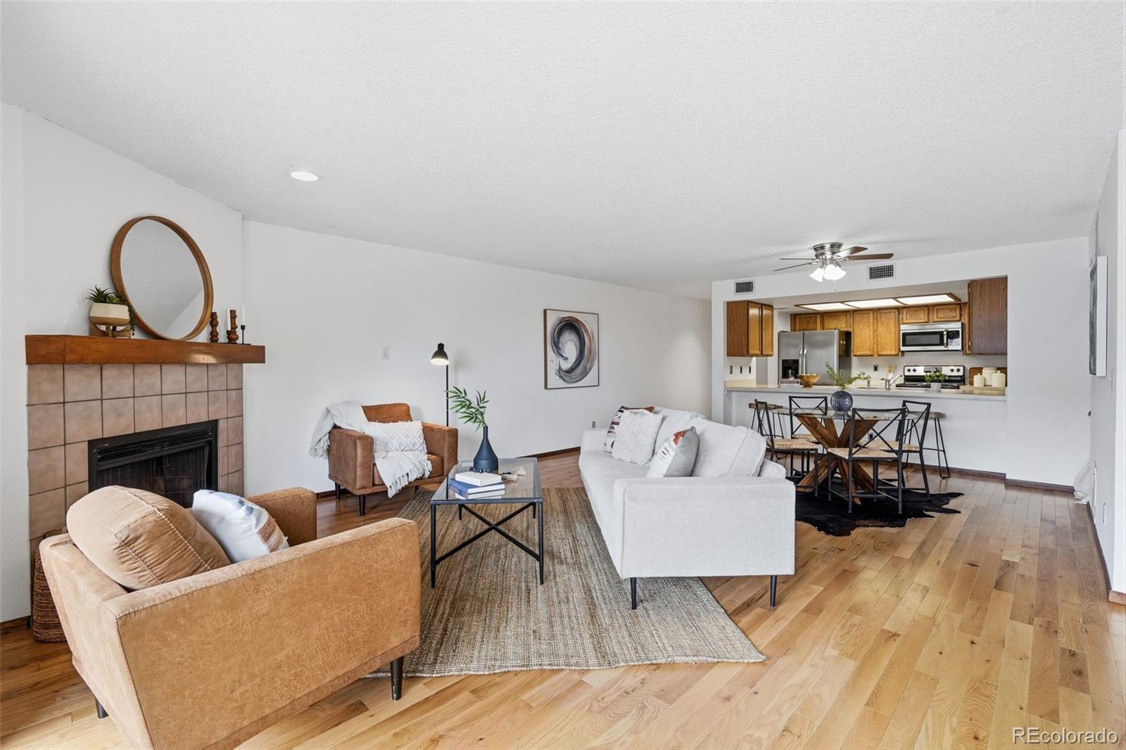 23557 Genesee Village Road, Unit A Golden, CO 80401 - Photo 7 of 38 a living room with furniture and wooden floor