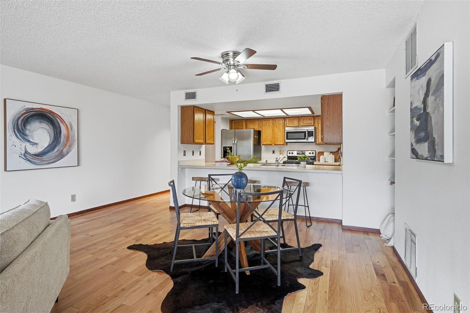 23557 Genesee Village Road, Unit A Golden, CO 80401 - Photo 9 of 38 a view of a dining room with furniture and a chandelier
